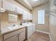 Laundry room with washer, dryer and a utility sink at 3464 Misty View Dr, Spring Hill, FL 34609