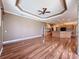 Open-concept living area with wood floors, recessed lights, wood kitchen cabinets, granite counters and island at 3464 Misty View Dr, Spring Hill, FL 34609
