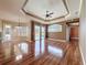 Bright living area showcases hardwood floors, recessed lighting, with large windows looking out to the pool at 3464 Misty View Dr, Spring Hill, FL 34609