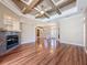 Bright living room featuring hardwood floors, a coffered ceiling, and ample natural light at 3464 Misty View Dr, Spring Hill, FL 34609
