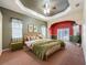 Comfortable main bedroom with a king size bed, ample natural light, and access to the outdoors at 3464 Misty View Dr, Spring Hill, FL 34609