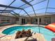 Relaxing pool with a screened enclosure and brick patio at 3464 Misty View Dr, Spring Hill, FL 34609