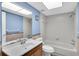 Bathroom with tub and shower featuring a single sink vanity and modern finishes at 3819 Teeside Dr, New Port Richey, FL 34655