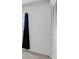 Bedroom featuring neutral walls, white closet doors and a dark curtain accenting the window at 3819 Teeside Dr, New Port Richey, FL 34655