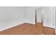 An airy bedroom features light walls complemented by wood-look flooring at 3819 Teeside Dr, New Port Richey, FL 34655