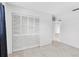 Bright bedroom features a spacious closet and neutral carpeting at 3819 Teeside Dr, New Port Richey, FL 34655
