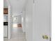 Hallway with tile floors and access to kitchen and living areas at 3819 Teeside Dr, New Port Richey, FL 34655
