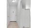 Hallway leading to the front door and featuring a utility closet at 3819 Teeside Dr, New Port Richey, FL 34655