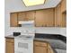 Kitchen area featuring standard appliances and a skylight for natural lighting at 3819 Teeside Dr, New Port Richey, FL 34655