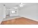 Open living area featuring tile and hardwood floors, a ceiling fan, and plenty of open space at 3819 Teeside Dr, New Port Richey, FL 34655