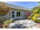 A back patio is surrounded by lush foliage at 3819 Teeside Dr, New Port Richey, FL 34655