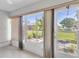 Bright sun room featuring tile floors and large windows looking out to the yard at 3819 Teeside Dr, New Port Richey, FL 34655
