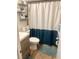 Well-organized bathroom with stylish vanity, sleek white toilet, and decorative shelving at 4264 Tamargo Dr # 3, New Port Richey, FL 34652