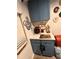 Practical coffee bar featuring stylish blue cabinets, white countertops and coffee-themed décor at 4264 Tamargo Dr # 3, New Port Richey, FL 34652