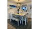 Inviting dining room with a modern table set, stylish lighting, and a view into the kitchen at 4264 Tamargo Dr # 3, New Port Richey, FL 34652