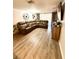 Spacious living room featuring an oversized, comfortable sectional sofa and wood-look flooring at 4264 Tamargo Dr # 3, New Port Richey, FL 34652