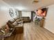 Inviting living room featuring comfortable seating, media center, and warm ambiance at 4264 Tamargo Dr # 3, New Port Richey, FL 34652