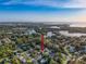 Expansive aerial view showcases proximity to coastal waters, serene location and neighborhood layout at 4934 Amherst Ct, New Port Richey, FL 34652