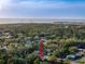Aerial view of coastal community; lush greenery, serene waterways, and desirable neighborhood layout at 4934 Amherst Ct, New Port Richey, FL 34652