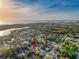 Stunning aerial view of the property showcasing its proximity to the water and lush surroundings at 4934 Amherst Ct, New Port Richey, FL 34652