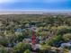 Beautiful aerial view highlights coastal proximity, lush landscaping, and neighborhood charm at 4934 Amherst Ct, New Port Richey, FL 34652