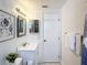 Well-lit bathroom with updated vanity, mirror, and fixtures. Tastefully decorated with modern details at 4934 Amherst Ct, New Port Richey, FL 34652