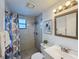 Updated bathroom with modern fixtures, tiled shower, and a stylish vanity at 4934 Amherst Ct, New Port Richey, FL 34652