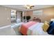 Inviting bedroom featuring mirrored closet doors, a ceiling fan, and a queen-size bed at 4934 Amherst Ct, New Port Richey, FL 34652
