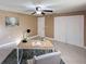 A home office with a desk, chair, and plenty of storage featuring neutral walls and tile floors at 4934 Amherst Ct, New Port Richey, FL 34652