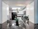 Modern kitchen with granite countertops, stainless steel appliances, and an open layout to the living areas at 4934 Amherst Ct, New Port Richey, FL 34652