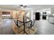 Contemporary dining and living area with sleek furniture, hardwood floors, and an open layout to the kitchen at 4934 Amherst Ct, New Port Richey, FL 34652