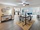 Bright, open-concept living and dining area features modern decor, stylish lighting, and updated floors at 4934 Amherst Ct, New Port Richey, FL 34652