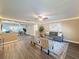 Comfortable living room with wood flooring, recessed lighting, neutral paint and decor, and a ceiling fan at 4934 Amherst Ct, New Port Richey, FL 34652