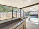 Spacious covered patio with a outdoor bar and view of pool and fenced yard at 4934 Amherst Ct, New Port Richey, FL 34652