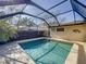 Private pool area with screened enclosure, offering a perfect spot for relaxation and recreation at 4934 Amherst Ct, New Port Richey, FL 34652