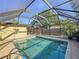 Enjoy Florida living in this inviting screened pool with covered area for relaxation and entertaining at 4934 Amherst Ct, New Port Richey, FL 34652