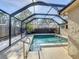 Sparkling private pool enclosed with a screened lanai and a well-maintained deck area at 4934 Amherst Ct, New Port Richey, FL 34652