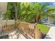 Inviting wooden deck with lush landscaping and mature trees, creating a private outdoor space at 520 Lafayette Blvd, Oldsmar, FL 34677