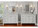 Modern bathroom with double vanity, marble countertops, and recessed lighting at 520 Lafayette Blvd, Oldsmar, FL 34677