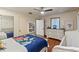 Bright bedroom features a bed with world map theme, hardwood floors and plenty of sunlight at 520 Lafayette Blvd, Oldsmar, FL 34677