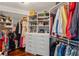 Walk-in closet features custom shelving and storage for clothes, shoes, and accessories at 520 Lafayette Blvd, Oldsmar, FL 34677