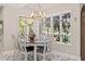 Bright dining area with large windows bringing in natural light, marble floors and designer lighting at 520 Lafayette Blvd, Oldsmar, FL 34677