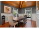 Dining room with wood floors, decorative wainscoting, and windows to the outdoors at 520 Lafayette Blvd, Oldsmar, FL 34677