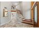 Grand entryway featuring marble floors, staircase with metal accents, and contemporary design at 520 Lafayette Blvd, Oldsmar, FL 34677