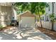 Detached garage with a paved driveway, offering convenience and additional storage space at 520 Lafayette Blvd, Oldsmar, FL 34677