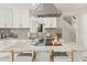 Modern kitchen with marble countertops, stainless steel appliances, and an island with bar seating at 520 Lafayette Blvd, Oldsmar, FL 34677