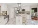 Spacious kitchen with white cabinetry, stainless steel appliances, and a center island with seating at 520 Lafayette Blvd, Oldsmar, FL 34677