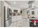 Bright kitchen featuring white cabinetry, modern appliances, and easy access to outdoor spaces at 520 Lafayette Blvd, Oldsmar, FL 34677