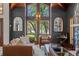 Bright living room boasts large windows, comfortable seating, and views of lush greenery at 520 Lafayette Blvd, Oldsmar, FL 34677