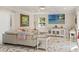Living room with marble floors, neutral sofa and modern decor, and a view to the backyard at 520 Lafayette Blvd, Oldsmar, FL 34677